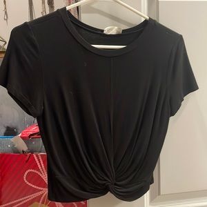 Black top (shorter but not “cropped”)